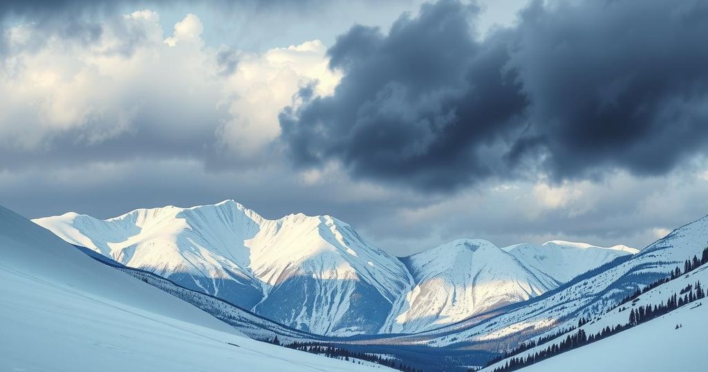 Snow-covered mountains in a national park with a dramatic sky and a hint of winter weather approaching.
